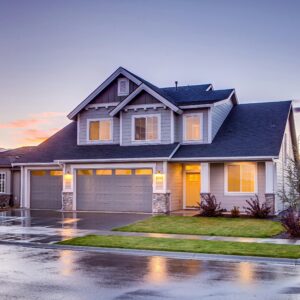 Blue and Gray Concrete House With Attic during Twilight